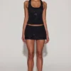 Aine Embellished Jersey Scoop-Neck Racerback Top i svart
