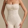 Arlena Jumpsuit med spets och rosettdetaljer i färg Ivory