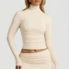 Auri Modal Ruched Backless Turtleneck Top i Ivory