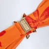 Baracoa bikinitopp med halterneck och metallbeslag i orange orkidé-mönster