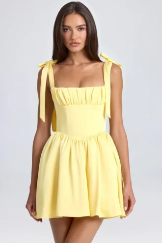 Bellamy draperad korsettminiklänning i citrongul