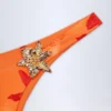 Beqa Bikinibyxor med metalldetaljer i orange orkidé-mönster