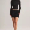 Cali Modal Ruched Mid-Rise Mini Kjol i svart