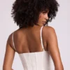 Cassandra vinylkorsett-crop-top med bygel i vitt