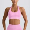Define Luxe sport-BH med halterneck i bubblegumrosa