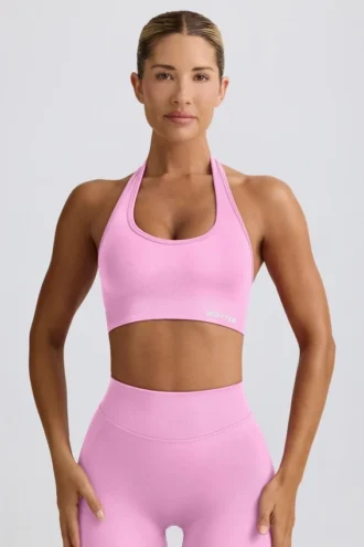 Define Luxe sport-BH med halterneck i bubblegumrosa