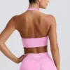 Define Luxe sport-BH med halterneck i bubblegumrosa