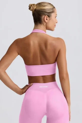 Define Luxe sport-BH med halterneck i bubblegumrosa