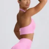 Define Luxe sport-BH med halterneck i bubblegumrosa