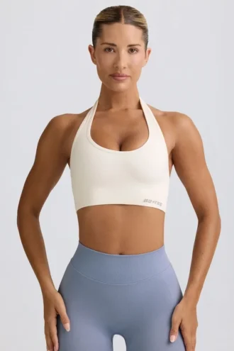 Define Luxe sport-BH med halterneck i vitt