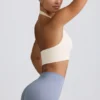 Define Luxe sport-BH med halterneck i vitt