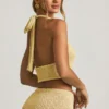Gianna bouclé-crop-top med halterneck i gult