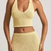 Gianna bouclé-crop-top med halterneck i gult