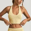 Gianna bouclé-crop-top med halterneck i gult