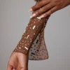 Guilia genomskinlig, dekorerad kort topp med långa ärmar i färgen Mocha