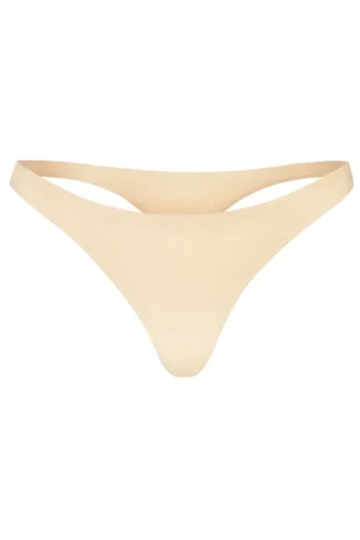 Intimates sömlös stickad string i varm persika