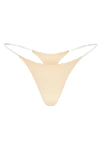 Intimates sömlös stickad string med genomskinliga band i Warm Peach