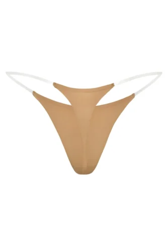 Intimates sömlös stringtrosa i karamellfärg med genomskinliga band