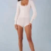 Ismera stickad långärmad jumpsuit i ivory