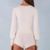 Ismera stickad långärmad jumpsuit i ivory
