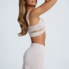 Kira Crop Top med utskärningar och detaljer i metall i himmelsgrått