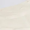 Korsad miniskort i borstad jersey i ivory marl