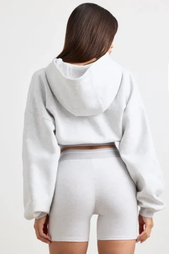 Kort hoodie i stretchig bomullsfleece i gråmelerat