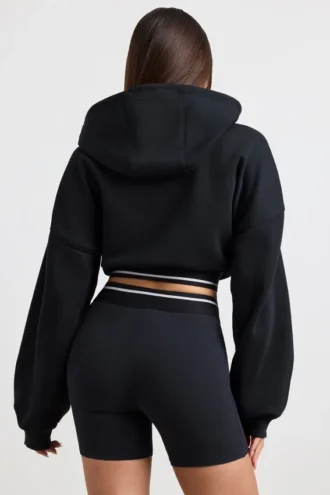 Kort hoodie i stretchig bomullsfleece i svart