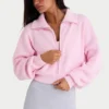 Kort sweatshirt i ribbad stickning med dragkedja i ljusrosa