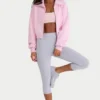 Kort sweatshirt i ribbad stickning med dragkedja i ljusrosa