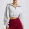 Kort sweatshirt med kvartslång dragkedja i gråmelerat