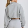 Kort sweatshirt med kvartslång dragkedja i gråmelerat