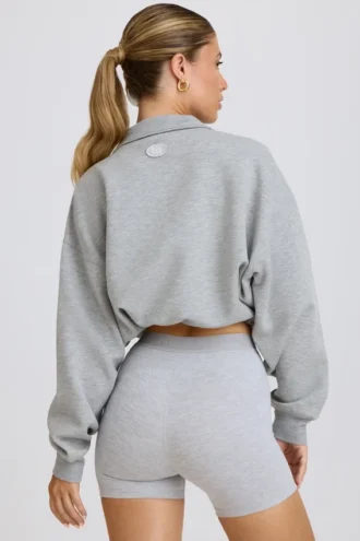 Kort sweatshirt med kvartslång dragkedja i gråmelerat