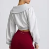 Kort sweatshirt med kvartslång dragkedja i gråmelerat