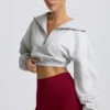 Kort sweatshirt med kvartslång dragkedja i gråmelerat