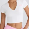 Kort T-shirt i stretchig bomullsjersey med grafiskt tryck i vitt
