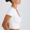 Kort T-shirt i stretchig bomullsjersey med grafiskt tryck i vitt
