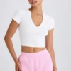 Kort T-shirt i stretchig bomullsjersey med grafiskt tryck i vitt