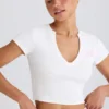 Kort T-shirt i stretchig bomullsjersey med grafiskt tryck i vitt