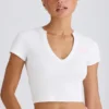 Kort T-shirt i stretchig bomullsjersey med grafiskt tryck i vitt