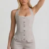 Lalita-playsuit med knappar och halterneck i ecru