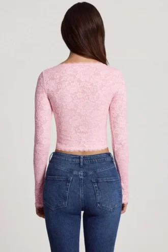 Lioren genomskinlig spets-top med djup urringning och långa ärmar i rosa