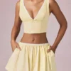 Magda crop top med rosettdetalj i citrongula ränder