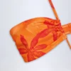 Maranta baddräkt med utskärningar och halterneck i orange orkidé-mönster