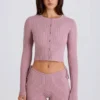 Mini-shorts i ribbad stickning med knytband i mauve