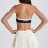 Mjuk, aktiv tennis-skort med plissering och låg midja i färgen Ivory