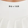 Mjuk, aktiv tennis-skort med plissering och låg midja i färgen Ivory