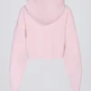 Mjuk, kort hoodie i stickat med dragkedja i ljusrosa
