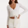 Mjuk stickad wrap-top i ivory