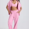 Mjuka joggingbyxor i bomullsjersey med medelhög midja och vida ben i babyrosa